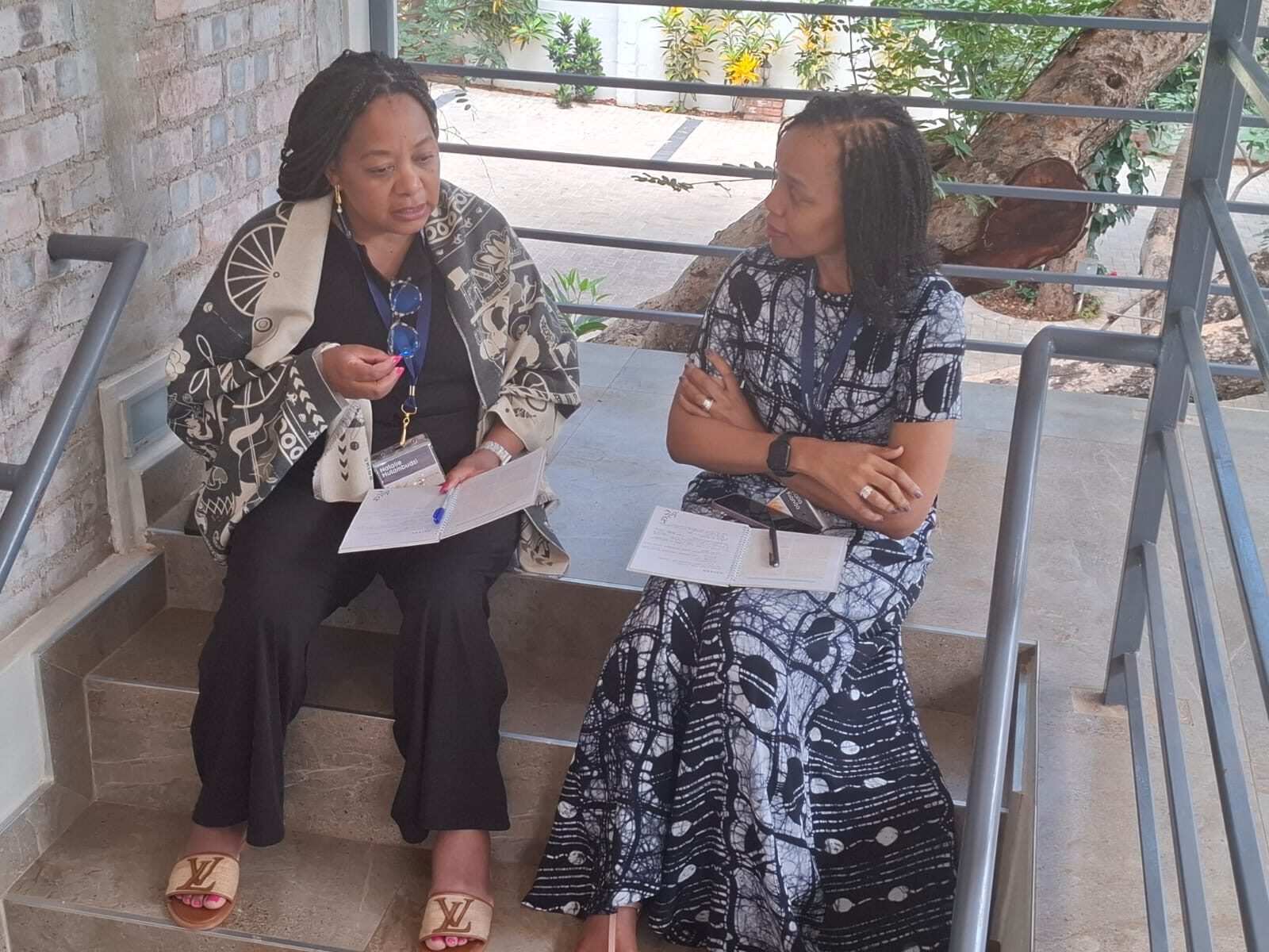 Two leaders in close conversation during an Equinexus session in Kenya